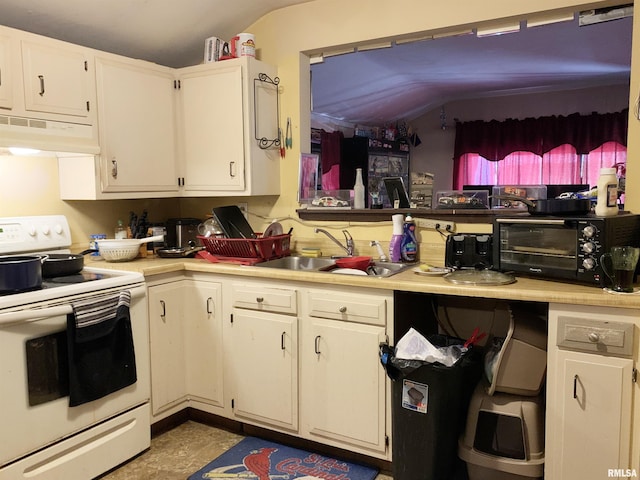 kitchen featuring white cabinetry, lofted ceiling, electric stove, sink, and light tile floors
