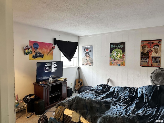 carpeted bedroom with a textured ceiling