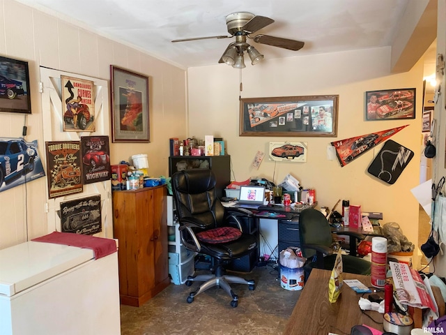 office with ceiling fan and concrete flooring