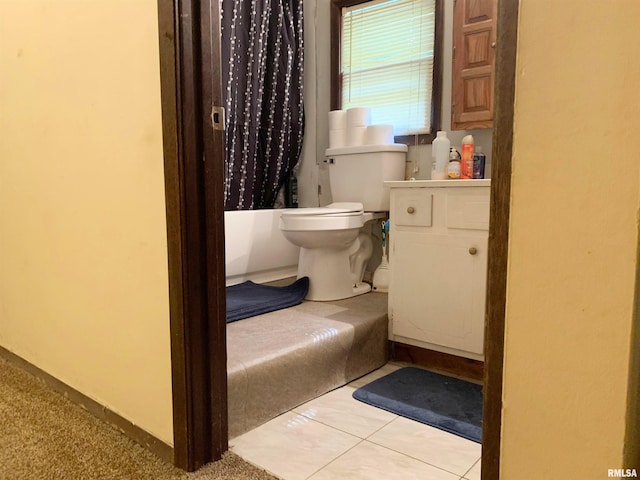 bathroom with tile floors and toilet