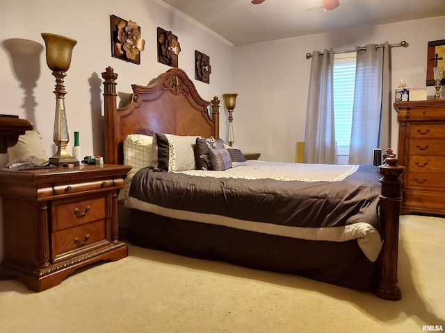 bedroom featuring ceiling fan, carpet floors, and crown molding