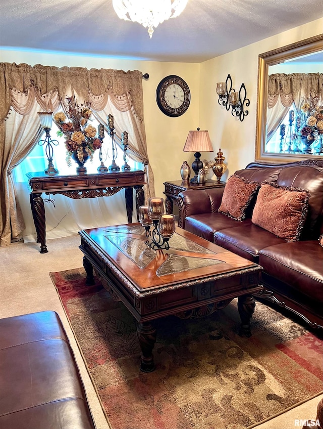 living room featuring carpet and a textured ceiling