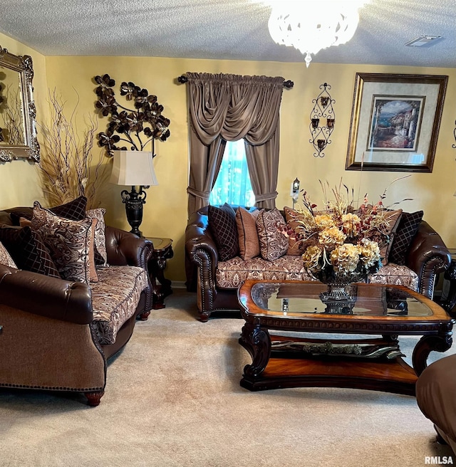 living room with carpet, an inviting chandelier, and a textured ceiling