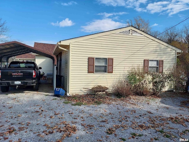 view of property exterior with a carport