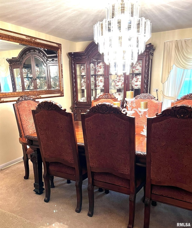 dining space featuring a notable chandelier