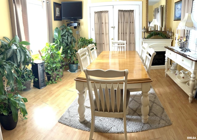 dining space with light wood-type flooring