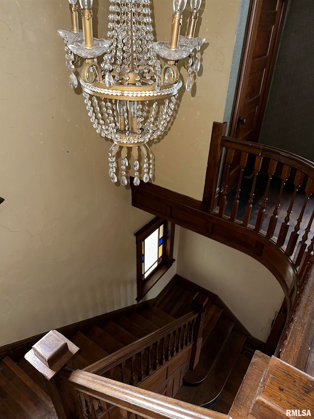 staircase featuring dark hardwood / wood-style floors