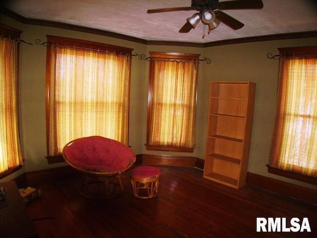 unfurnished room with ornamental molding, ceiling fan, and dark hardwood / wood-style flooring