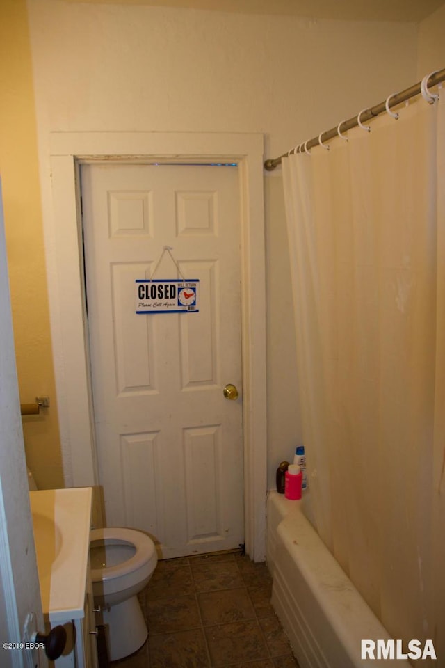 full bathroom with shower / bath combination with curtain, toilet, vanity, and tile flooring