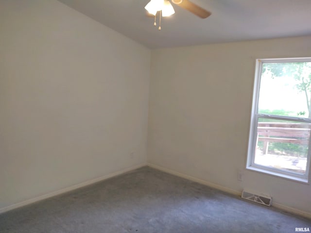 unfurnished room with ceiling fan and carpet