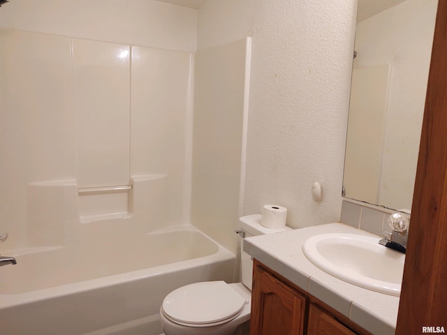 full bathroom with shower / washtub combination, vanity, and toilet