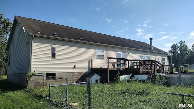 back of house with a wooden deck