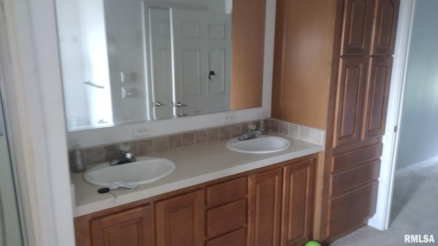 full bathroom featuring a sink and double vanity