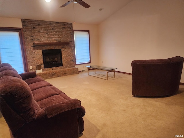 living room featuring a fireplace, plenty of natural light, and carpet flooring