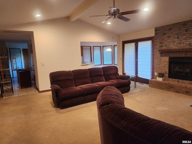 living room featuring a brick fireplace, ceiling fan, light colored carpet, and lofted ceiling with beams