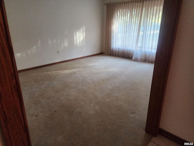 unfurnished room with carpet floors