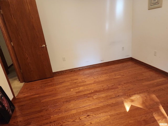 empty room with light hardwood / wood-style floors