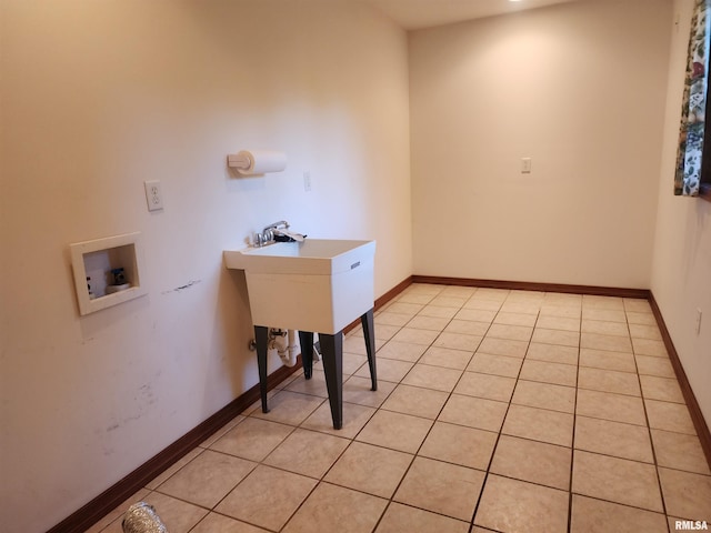 washroom featuring washer hookup and light tile patterned floors