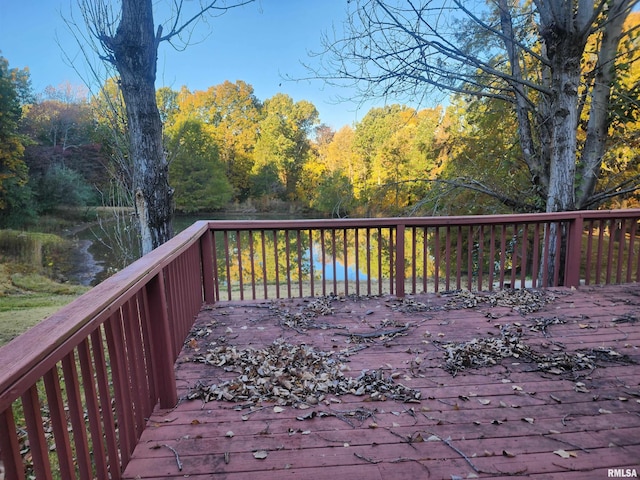 wooden terrace with a water view