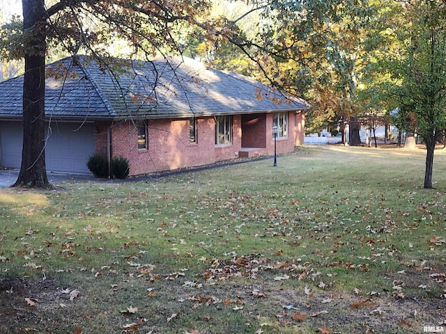 view of property exterior featuring a lawn and a garage