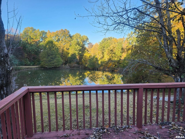 wooden deck featuring a water view and a yard