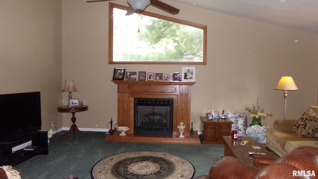 carpeted living room with ceiling fan and vaulted ceiling