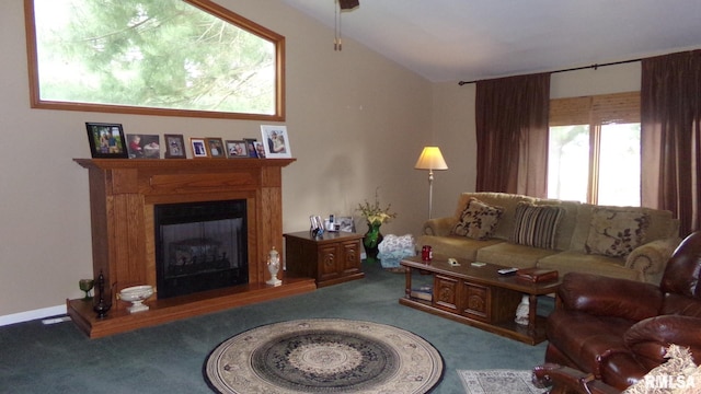 living room featuring lofted ceiling, carpet, and a wealth of natural light