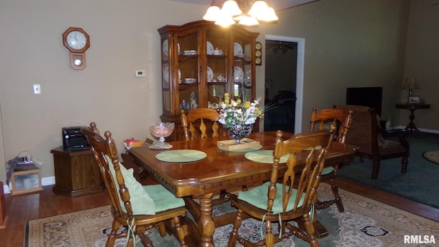 805 W Race St, Ridgway, IL 62979 - dining room featuring a notable chandelier and dark hardwood / wood-style floors