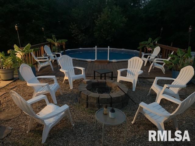 view of patio featuring an outdoor fire pit