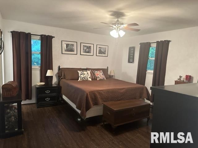 bedroom featuring dark wood-type flooring and ceiling fan