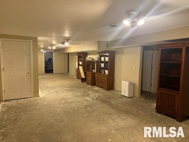 basement with a textured ceiling