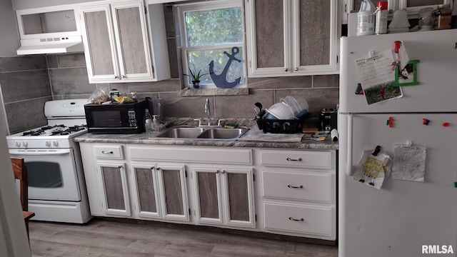 kitchen with ventilation hood, sink, light wood-type flooring, white cabinets, and white appliances