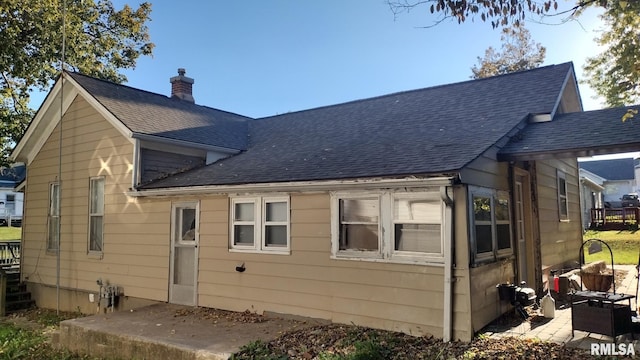 back of house with a patio