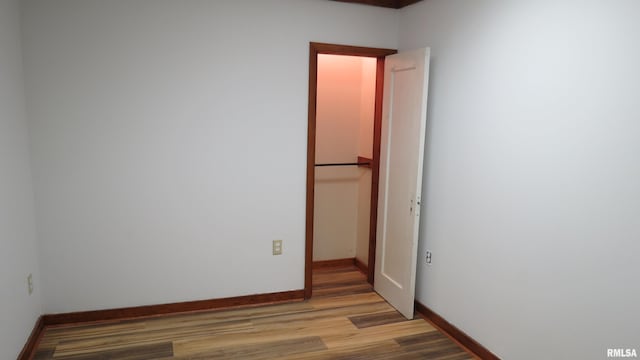 unfurnished room with light hardwood / wood-style flooring