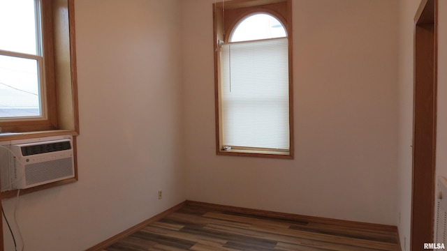 spare room with dark hardwood / wood-style flooring