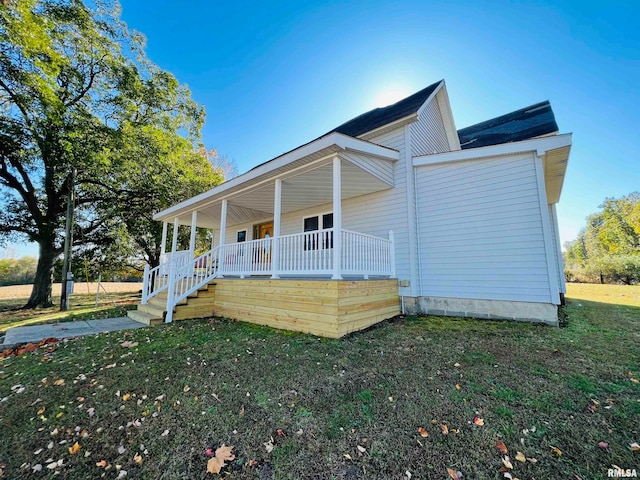 view of front of home with a front lawn and a porch