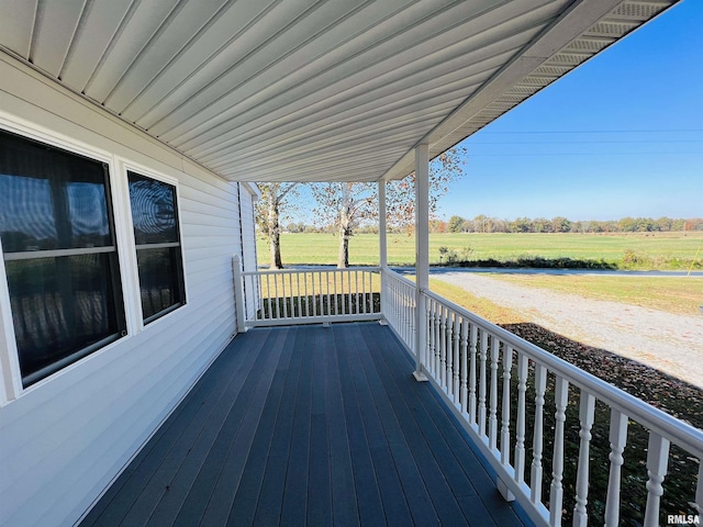 wooden terrace featuring a rural view