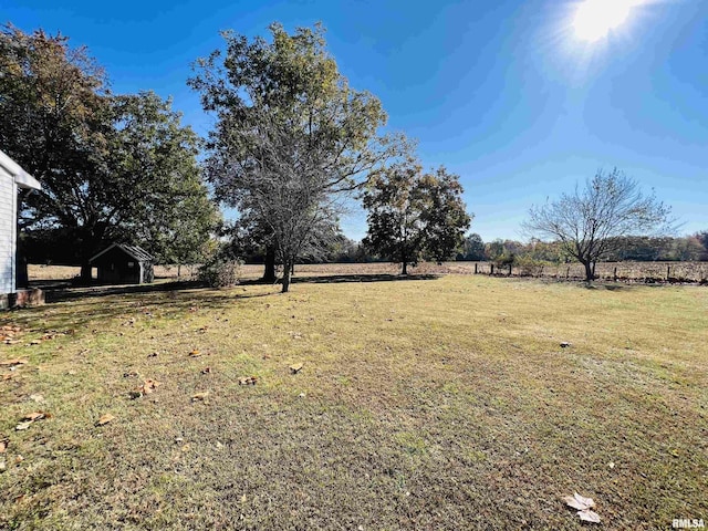 view of yard with a rural view