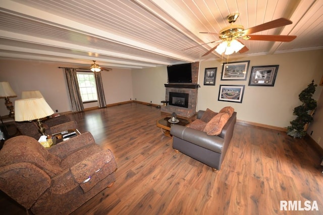 living room featuring crown molding, wood-type flooring, wood ceiling, and a brick fireplace