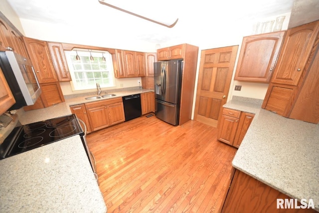 kitchen with sink, black dishwasher, stainless steel fridge with ice dispenser, light hardwood / wood-style floors, and electric stove