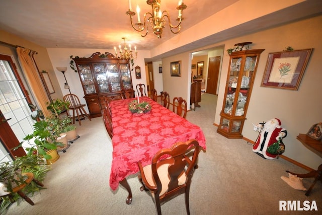 carpeted dining area with a notable chandelier