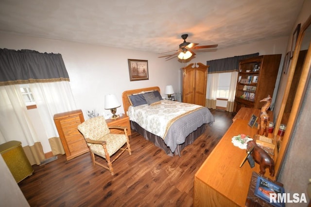 bedroom featuring ceiling fan and dark hardwood / wood-style flooring