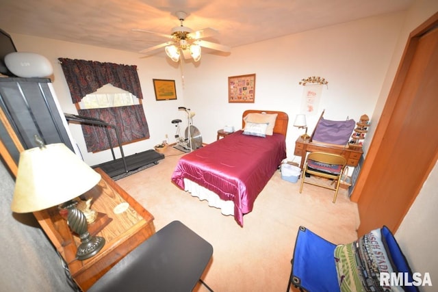 bedroom with ceiling fan and carpet floors