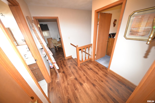 hall with dark hardwood / wood-style floors