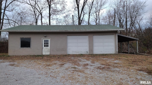 garage featuring a carport