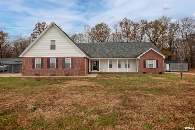 view of front of house with a front lawn and a carport