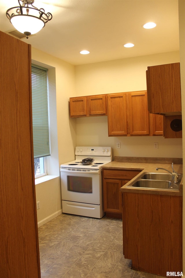 kitchen with sink and white range with electric cooktop