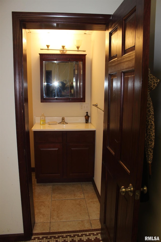 bathroom with vanity and tile patterned floors