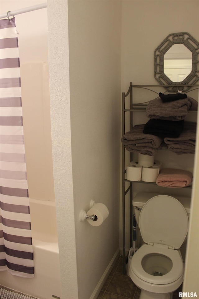 bathroom featuring shower / tub combo and tile patterned flooring