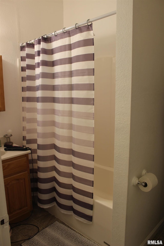 bathroom with shower / bath combination with curtain, vanity, and tile patterned floors